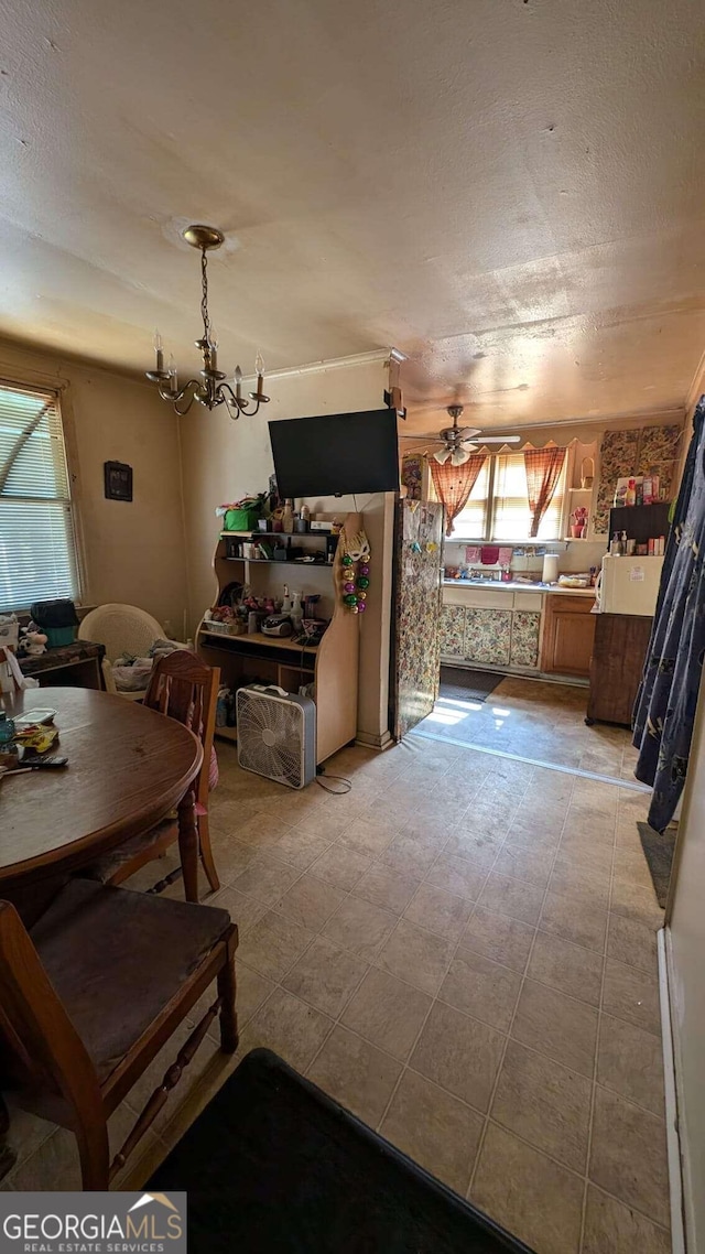 1870 Bethlea Ave, Macon, GA 31204 - dining space with a chandelier, a textured ceiling, and a ceiling fan