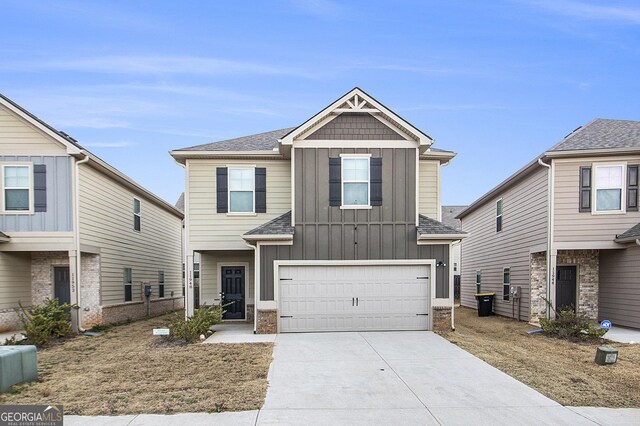 view of front of house with a front lawn and a garage