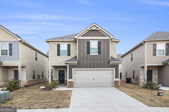 11948 Brightside Pkwy, Hampton, GA 30228 - view of front of home featuring board and batten siding, driveway, a garage, and a shingled roof