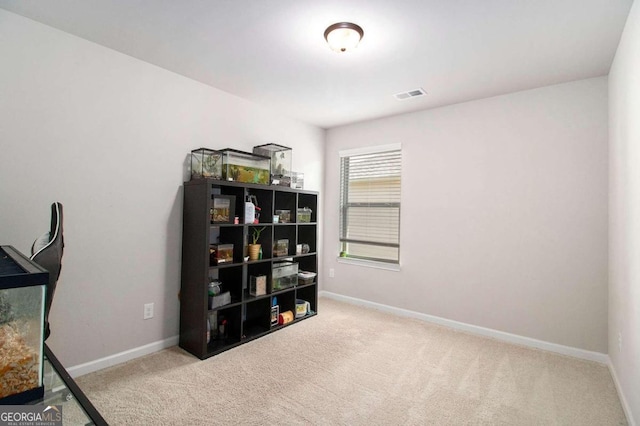 interior space featuring light colored carpet