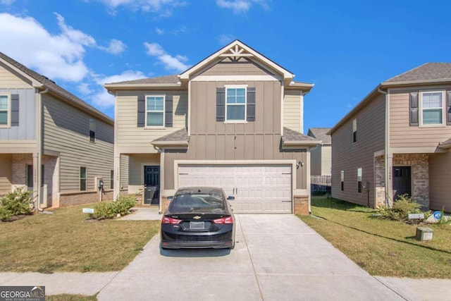 view of front facade with a front yard and a garage