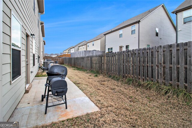 back of property with a patio and cooling unit