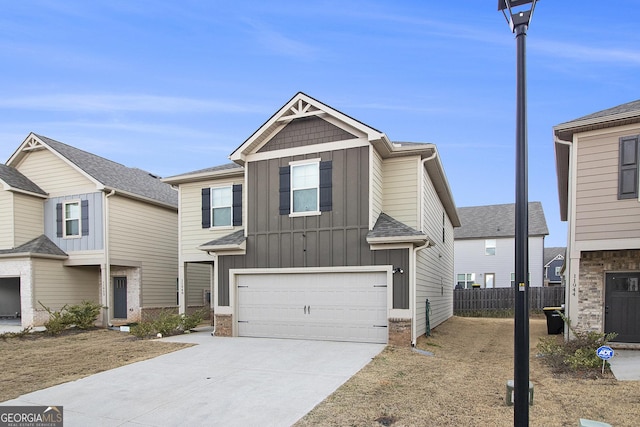 11948 Brightside Pkwy, Hampton, GA 30228 - view of front of house featuring board and batten siding, driveway, and a garage