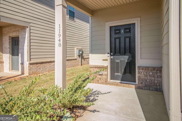 11948 Brightside Pkwy, Hampton, GA 30228 - doorway to property featuring brick siding