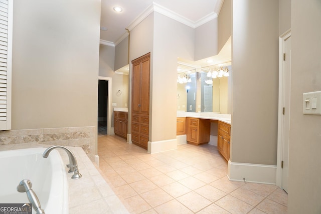 bathroom featuring crown molding, vanity, a garden tub, and tile patterned floors