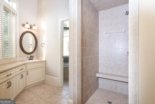 full bathroom with tiled shower, healthy amount of natural light, and tile patterned flooring