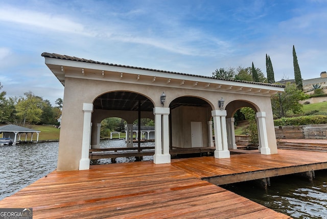 dock area with a water view