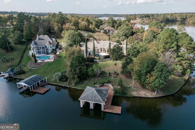 aerial view of property and surrounding area featuring a large body of water