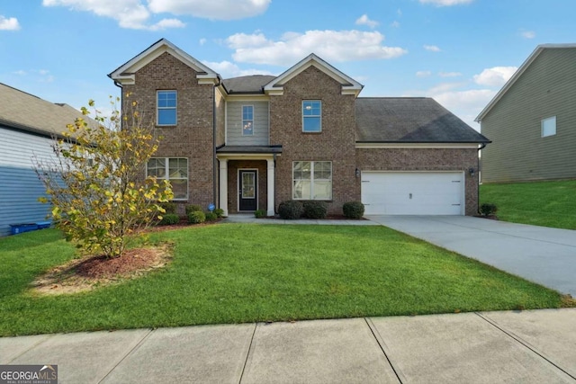 view of front of home with a front lawn and a garage