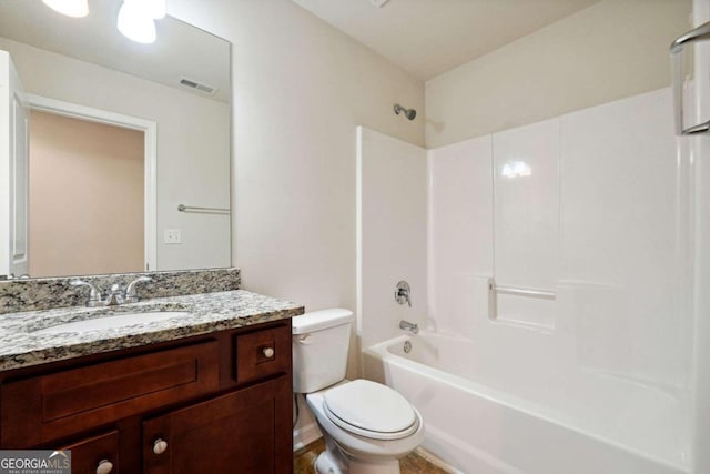 full bathroom featuring  shower combination, vanity, and toilet