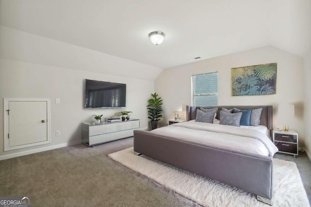 bedroom featuring vaulted ceiling and carpet flooring