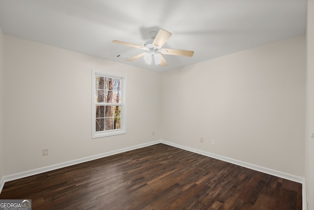 unfurnished room featuring ceiling fan and dark hardwood / wood-style flooring