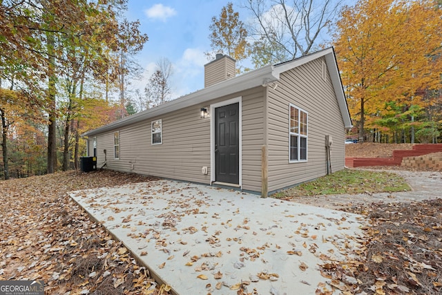 rear view of property featuring a patio area and central AC unit