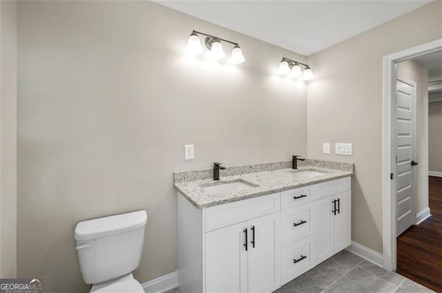 bathroom featuring vanity and toilet