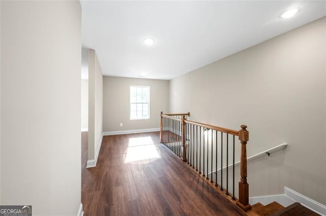 hall with dark hardwood / wood-style flooring