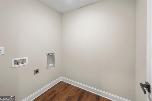 clothes washing area with hookup for a washing machine, dark hardwood / wood-style floors, and hookup for an electric dryer