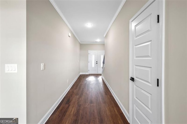 hall featuring ornamental molding and dark hardwood / wood-style floors