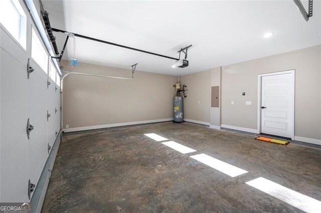 garage with a garage door opener, electric panel, and water heater