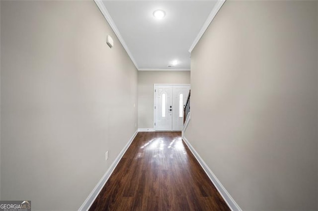 hall with crown molding and dark hardwood / wood-style floors