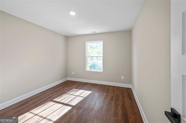 empty room featuring dark hardwood / wood-style floors