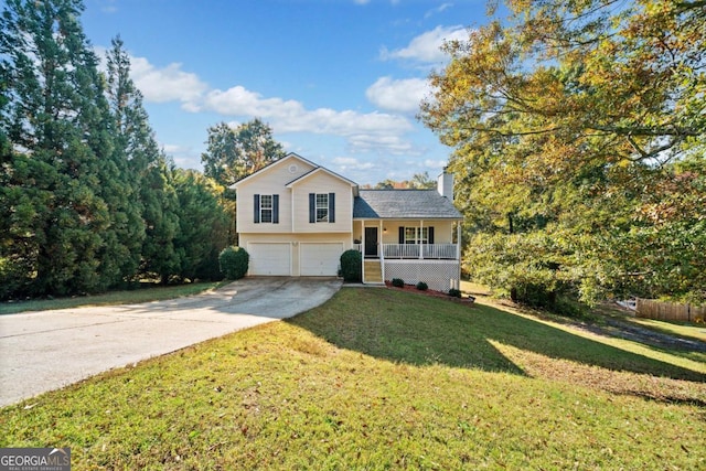 split level home with a front yard and a garage