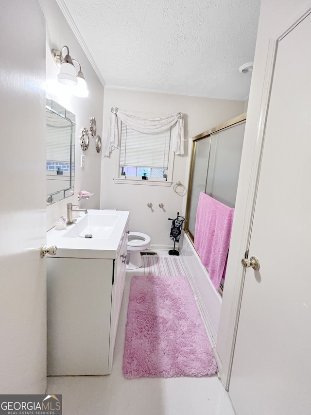 full bathroom with enclosed tub / shower combo, vanity, a textured ceiling, and crown molding