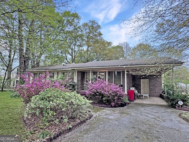 ranch-style home with a carport