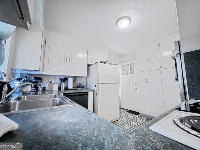 kitchen featuring sink, a textured ceiling, white cabinets, white refrigerator, and dishwasher