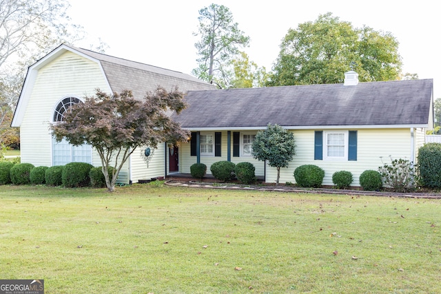 ranch-style home with a front lawn