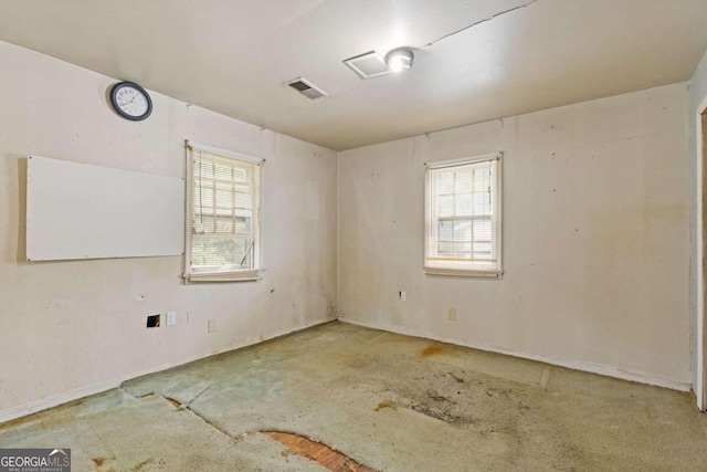 empty room with carpet flooring