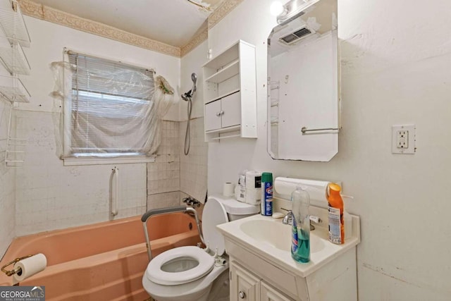 full bathroom with vanity, toilet, and tiled shower / bath