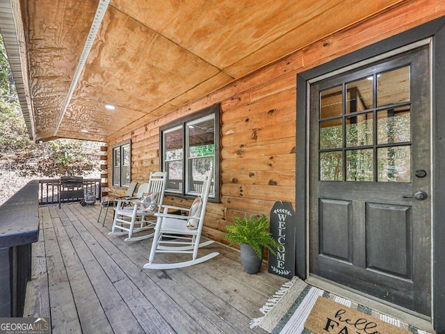 wooden terrace with covered porch