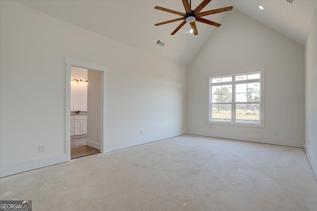 unfurnished bedroom featuring high vaulted ceiling, ceiling fan, and connected bathroom