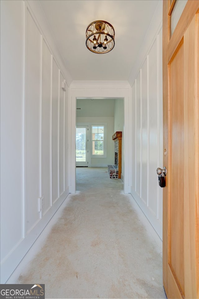 corridor featuring ornamental molding