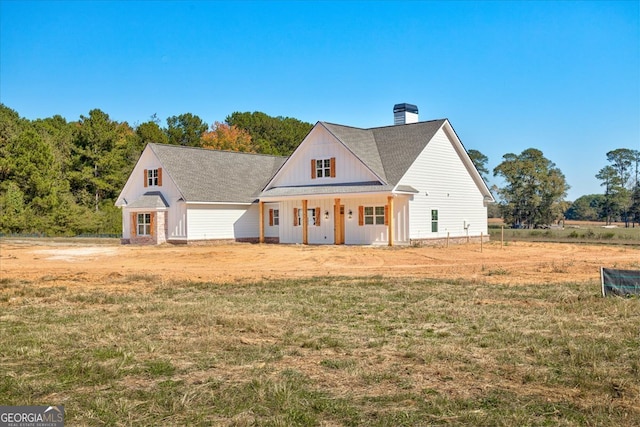 view of front facade with a porch and a front yard