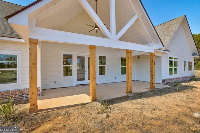 rear view of property with ceiling fan and a patio