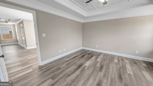 empty room featuring crown molding, light hardwood / wood-style flooring, and ceiling fan