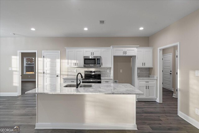 kitchen featuring gray cabinetry, hardwood / wood-style flooring, sink, and dishwasher