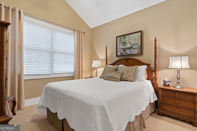 carpeted bedroom featuring ceiling fan and lofted ceiling