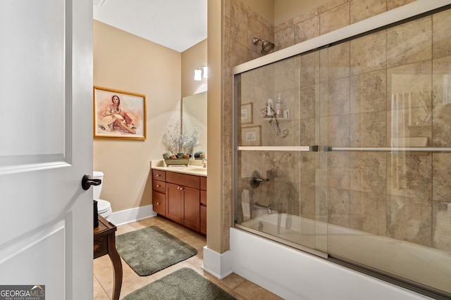 bathroom featuring vanity, bath / shower combo with glass door, and tile patterned floors