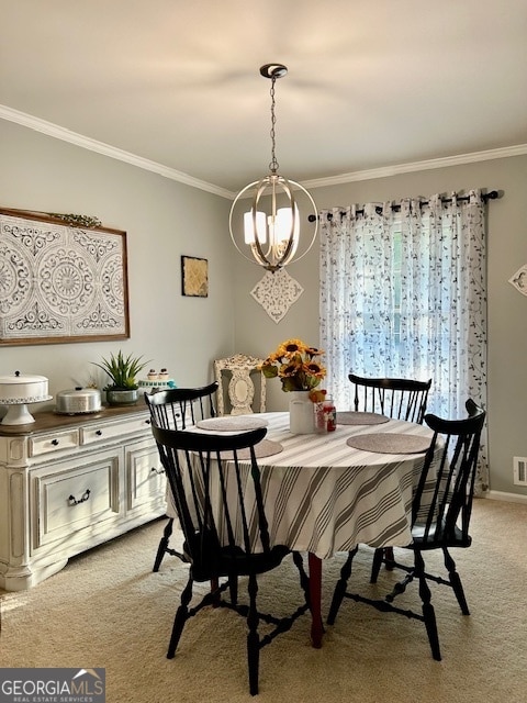 dining space with ornamental molding, a chandelier, and light carpet