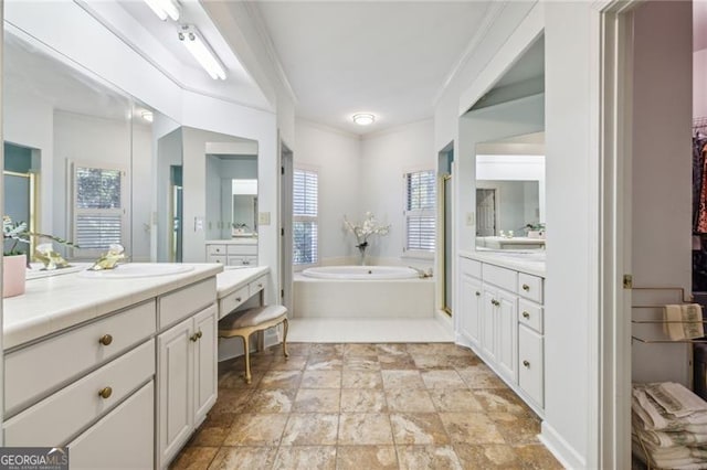 bathroom featuring a tub to relax in, vanity, and ornamental molding