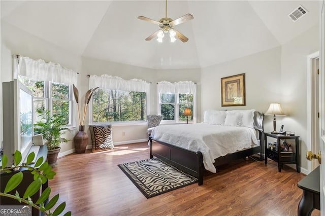 bedroom with hardwood / wood-style floors, ceiling fan, and lofted ceiling