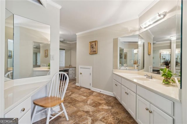 bathroom with vanity and ornamental molding