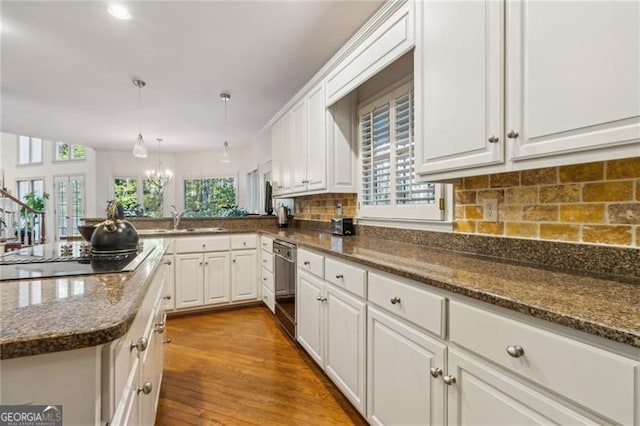 456 N Saint Marys Ln, Marietta, GA 30064 - kitchen with dishwasher, a sink, black electric cooktop, and white cabinetry