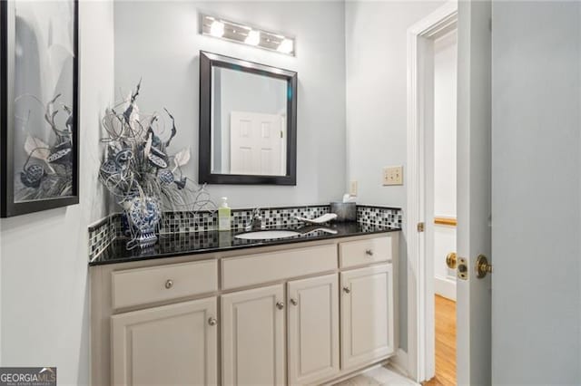 bathroom with hardwood / wood-style floors and vanity