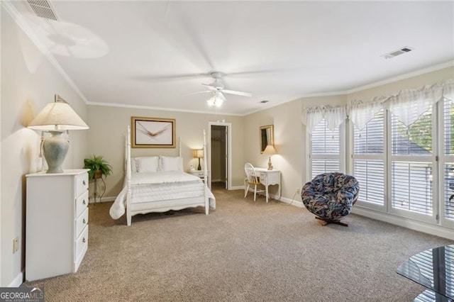 bedroom with ceiling fan, carpet, and ornamental molding