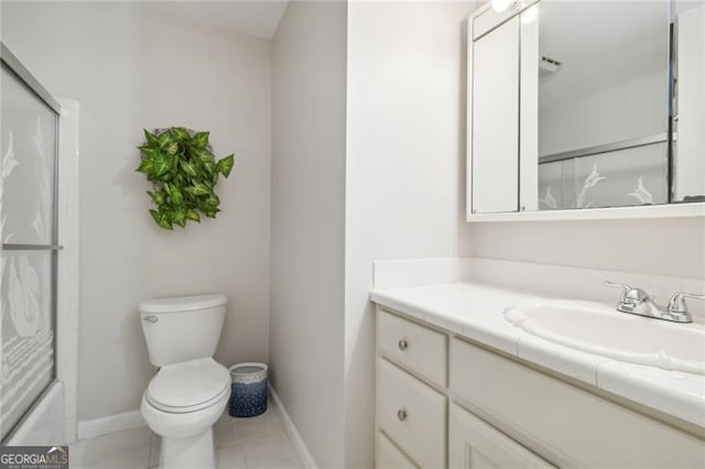 full bathroom with tile patterned flooring, vanity, toilet, and bath / shower combo with glass door