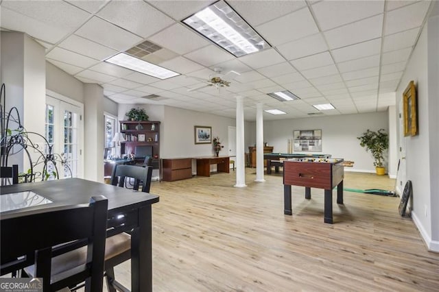 playroom with french doors, a paneled ceiling, light hardwood / wood-style floors, and ceiling fan