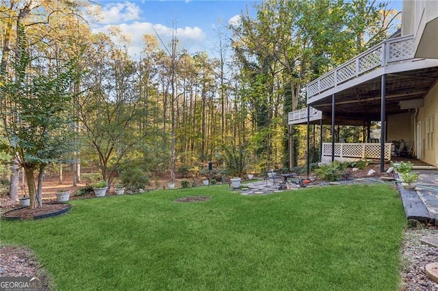 view of yard featuring a wooden deck